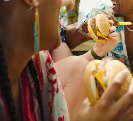 2 Females enjoying their burgers for lunch