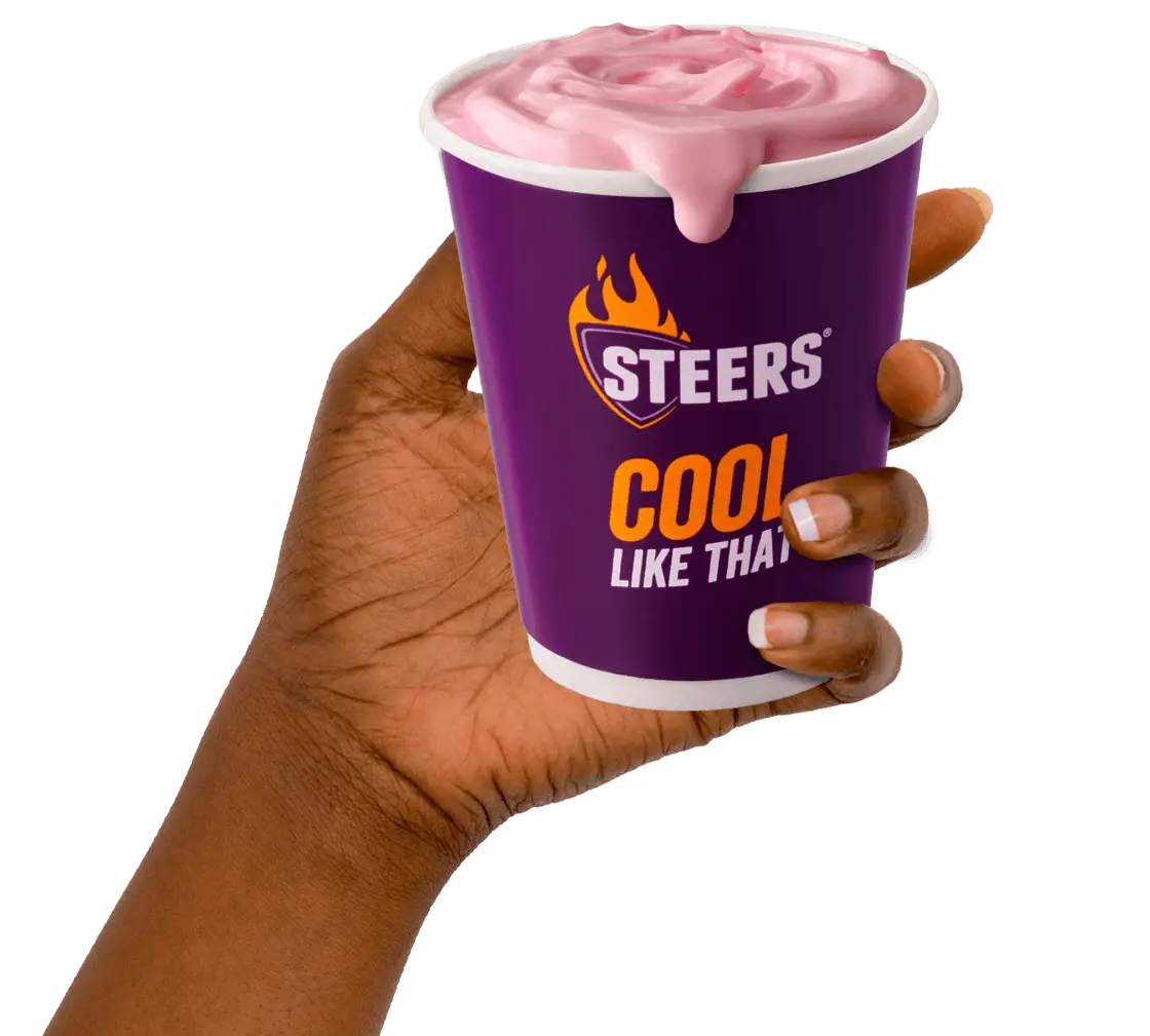 - Hand holding takeaway milkshake from Steers