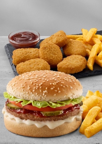 Burger combo meal with lettuce, tomato, pickles, creamy mayo sauce, crispy French fries, crispy chicken nuggets, and ketchup dip