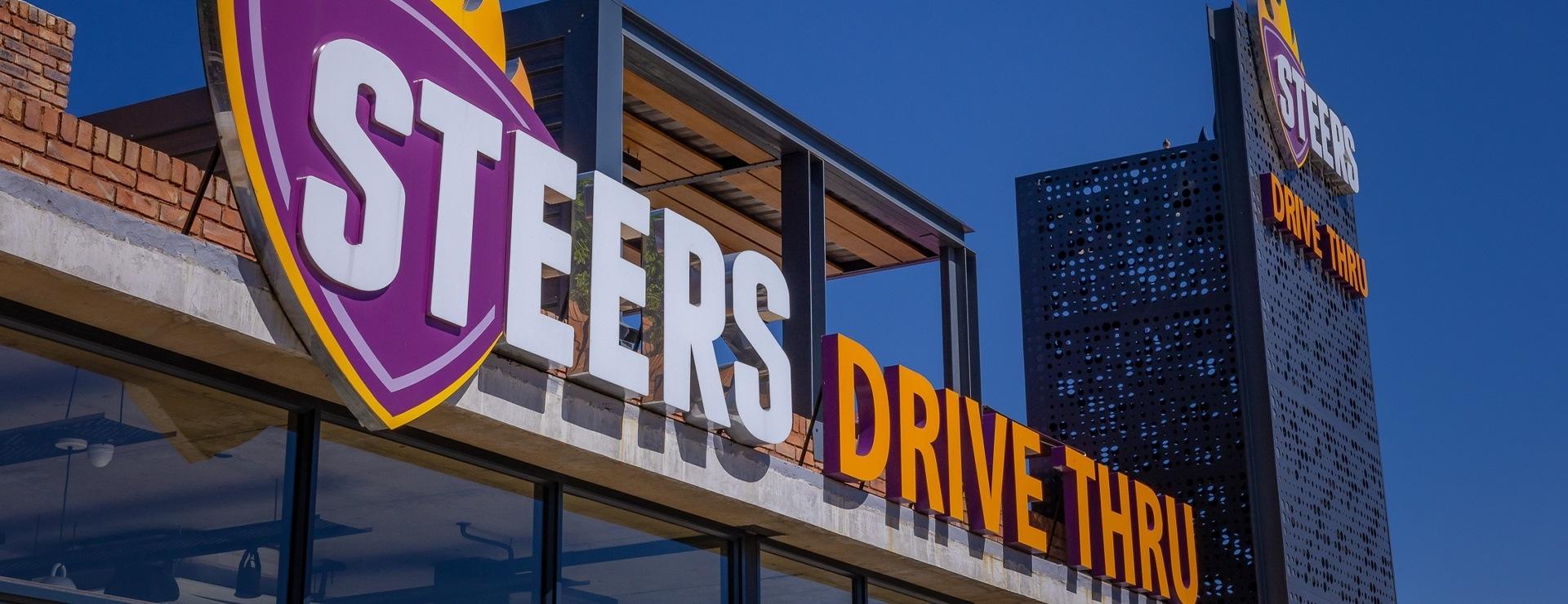 Steers drive thru sign
