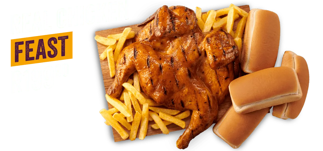 Steers® Full Chicken and chips on a wooden board with 4 loaves of bread.