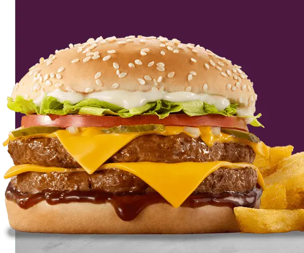 King Steer double burger with flame-grilled beef patties, melted cheese, lettuce and chips on purple background