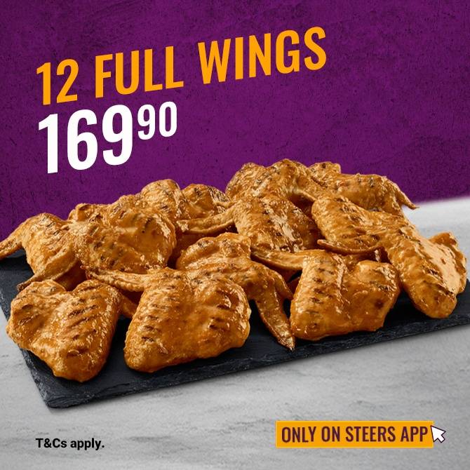 12 Full Chicken Wings on a black slate