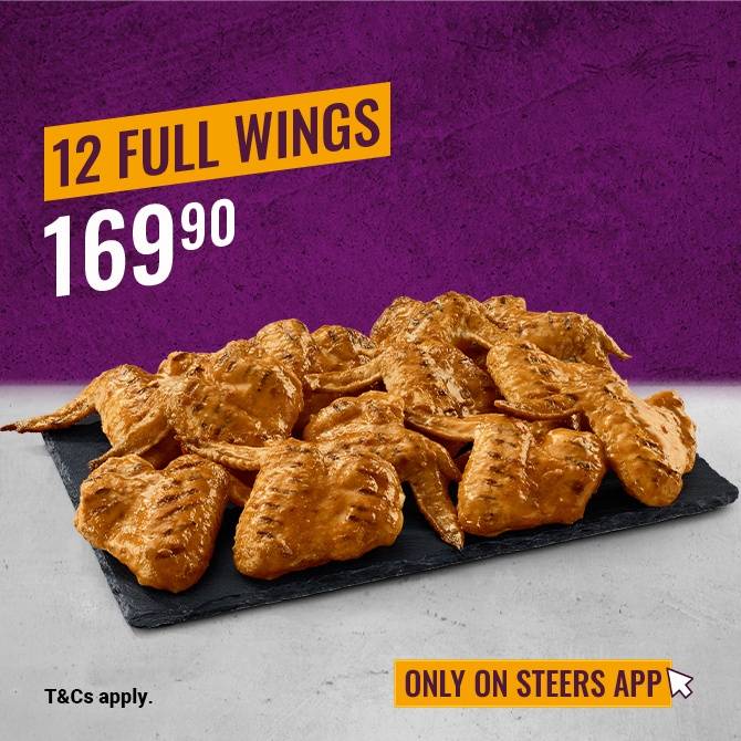 12 Full Chicken Wings on a black slate